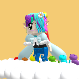 Rainbow hair popit in hand and a rainbow cats