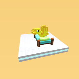 a yellow bird on a bed