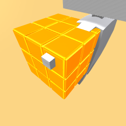 holding a golden rubix cube
