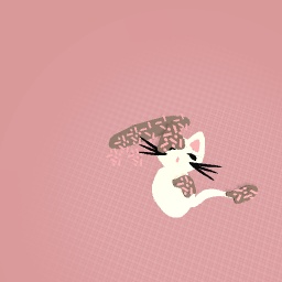 Desert kitten sitting on a donut.