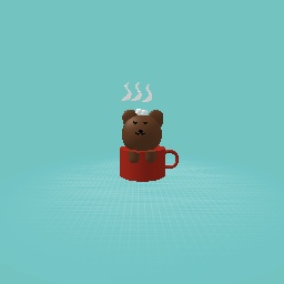 Little bear cub in a mug of coco with marsh mellows